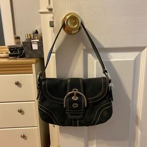 Black and silver Coach purse